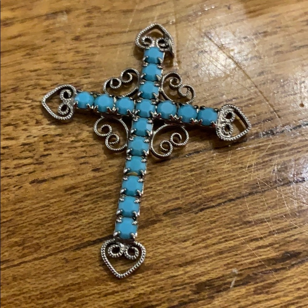 Silver and turquoise stone cross